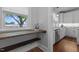 Walk-in pantry with natural light and wooden shelves near the kitchen at 2227 Us-15, Creedmoor, NC 27522