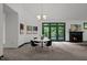 The dining room features a fireplace, art, and access to the outdoors at 224 Crawford Rd, Hillsborough, NC 27278
