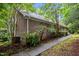 Brick exterior home with a concrete walkway and lots of well kept landscaping and shrubbery at 224 Crawford Rd, Hillsborough, NC 27278