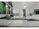 A bright kitchen featuring a center island, green trim, and natural light at 224 Crawford Rd, Hillsborough, NC 27278