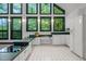 Bright kitchen featuring white appliances, ample counter space, and large windows at 224 Crawford Rd, Hillsborough, NC 27278