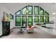 Bright open living space featuring a fireplace and large windows with picturesque views at 224 Crawford Rd, Hillsborough, NC 27278