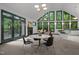 Open-concept living area with large windows and a fireplace, perfect for entertaining at 224 Crawford Rd, Hillsborough, NC 27278