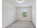 Bright bedroom featuring natural light and plush carpeting at 246 Spark St, Raleigh, NC 27606