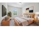 Bedroom showcasing a large window, stylish decor, and plush carpeting at 246 Spark St, Raleigh, NC 27606