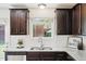 Bright kitchen featuring granite counters, subway tile backsplash, and stainless steel appliances at 246 Spark St, Raleigh, NC 27606