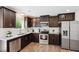 Well-equipped kitchen with stainless steel appliances, granite countertops, and ample cabinet space at 246 Spark St, Raleigh, NC 27606