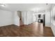 Bright living room featuring hardwood floors, a staircase, and an open layout at 246 Spark St, Raleigh, NC 27606