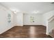 Bright living room with hardwood floors, and stairs at 246 Spark St, Raleigh, NC 27606