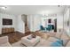Bright living room featuring hardwood floors, a staircase, and an open layout perfect for entertaining at 246 Spark St, Raleigh, NC 27606
