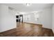 Open-concept living space with wood floors, staircase, and a modern kitchen at 246 Spark St, Raleigh, NC 27606