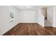 Bright living room with hardwood floors and stairs at 246 Spark St, Raleigh, NC 27606