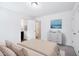 Bright main bedroom featuring neutral decor, ensuite bath, and carpeted floors at 246 Spark St, Raleigh, NC 27606