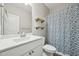 Bathroom featuring a white vanity, a large mirror, and open wood shelves at 256 Summer Ranch Dr, Fuquay Varina, NC 27526