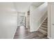 Light and bright entryway with wood floors and stair access to the second floor at 256 Summer Ranch Dr, Fuquay Varina, NC 27526