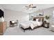 Spacious and well-lit primary bedroom suite with ceiling fan, art and decor at 256 Summer Ranch Dr, Fuquay Varina, NC 27526