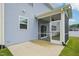 Enjoy the outdoors bug-free on this home's screened-in porch with sliding glass door access to the backyard at 256 Summer Ranch Dr, Fuquay Varina, NC 27526