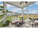 Comfortable screened porch featuring an outdoor seating and dining area at 256 Summer Ranch Dr, Fuquay Varina, NC 27526