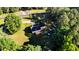 Aerial view of home with large yard, mature trees, wooden decks, and plenty of privacy at 2619 Steel Bridge Rd, Sanford, NC 27330