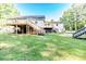Rear of home with multiple decks and access to the yard. Includes stairs, and a chain-link fence at 2619 Steel Bridge Rd, Sanford, NC 27330