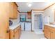 Bright bathroom featuring a single shower stall, washer, dryer, sink, toilet and ample storage at 2619 Steel Bridge Rd, Sanford, NC 27330