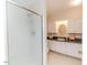 Bathroom with cabinets, sink and shower with glass door at 2619 Steel Bridge Rd, Sanford, NC 27330