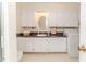Bathroom with cabinets, sink, washing machine and granite countertop at 2619 Steel Bridge Rd, Sanford, NC 27330