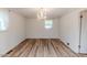 Elegant dining room with crystal chandelier, wood floors, and natural light at 2619 Steel Bridge Rd, Sanford, NC 27330