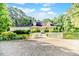 Charming single-story home with white picket fence and well-manicured landscaping creating a welcoming curb appeal at 2619 Steel Bridge Rd, Sanford, NC 27330