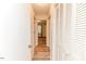 Hallway view of interior doors featuring laminate wood flooring at 2619 Steel Bridge Rd, Sanford, NC 27330