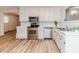 Bright and airy kitchen with stainless steel appliances, white cabinets and a garden view at 2619 Steel Bridge Rd, Sanford, NC 27330