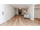 Spacious living room featuring a brick fireplace, built-in shelving and hard surface floors at 2619 Steel Bridge Rd, Sanford, NC 27330