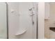 Bathroom tiled shower with shower head and corner seat at 2619 Steel Bridge Rd, Sanford, NC 27330