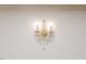 Close up of an ornate wall sconce with crystal accents and two lights at 2619 Steel Bridge Rd, Sanford, NC 27330
