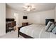 Neutral bedroom featuring carpet, ceiling fan, desk, and a comfortable bed at 270 Wembley Dr, Clayton, NC 27527