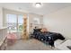 Cozy bedroom with a large window, carpeted floor, and ample natural light at 270 Wembley Dr, Clayton, NC 27527