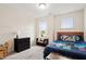 Bright bedroom featuring carpet, light-colored walls, dark-colored dresser, and Minecraft-themed bedspread at 270 Wembley Dr, Clayton, NC 27527