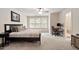 Spacious bedroom with large windows, carpet, and ceiling fan at 270 Wembley Dr, Clayton, NC 27527