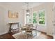 Charming dining area with a round table, four chairs, and a window view at 270 Wembley Dr, Clayton, NC 27527