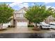 Charming townhome featuring a two-car garage and well-maintained landscaping at 270 Wembley Dr, Clayton, NC 27527