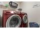 Laundry room featuring red Samsung washing machine and dryer at 270 Wembley Dr, Clayton, NC 27527