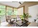 Relaxing screened porch with comfortable seating and a peaceful outdoor view at 270 Wembley Dr, Clayton, NC 27527
