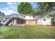 A view of the backyard showing a deck, access to the house, and a shed at 2800 Glen Burnie Dr, Raleigh, NC 27607