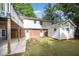 Backyard featuring brick accents, a shed, and access doors to the basement and main level at 2800 Glen Burnie Dr, Raleigh, NC 27607