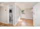 Basement with wood-look flooring, a bathroom, and an exterior door at 2800 Glen Burnie Dr, Raleigh, NC 27607
