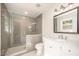 Modern bathroom featuring a tiled shower with glass door and a vanity sink at 2800 Glen Burnie Dr, Raleigh, NC 27607