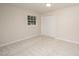 A bright bedroom featuring neutral walls, carpet, a window, and a closet at 2800 Glen Burnie Dr, Raleigh, NC 27607