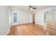 Bedroom with hardwood floors, closet with mirrored doors, and an ensuite bathroom at 2800 Glen Burnie Dr, Raleigh, NC 27607