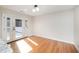 Bright dining area with hardwood floors and doors leading to a deck at 2800 Glen Burnie Dr, Raleigh, NC 27607