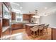 Spacious kitchen featuring granite counters, stainless appliances, and a large island with seating at 2800 Glen Burnie Dr, Raleigh, NC 27607